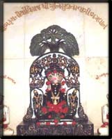 Picture of Bluish idol of Shri Munisuvrat Swami, in Padmasan position, is present in the temple.